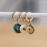 earrings with decorated round charm and stone turquoise/gold
